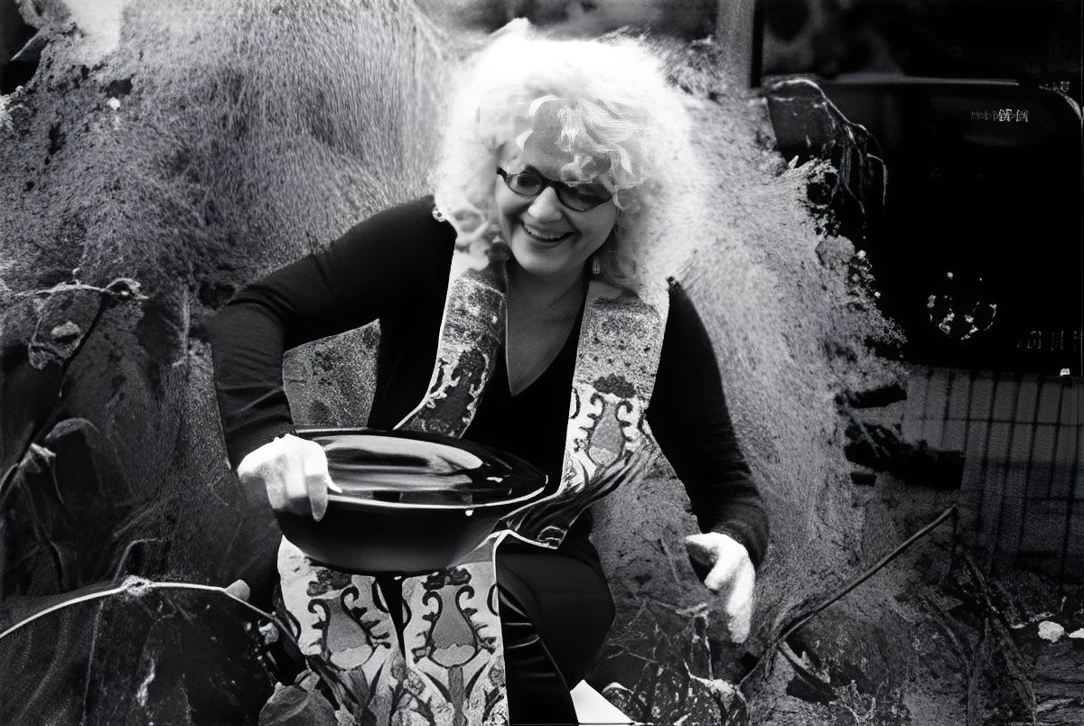 Woman holding a black pan