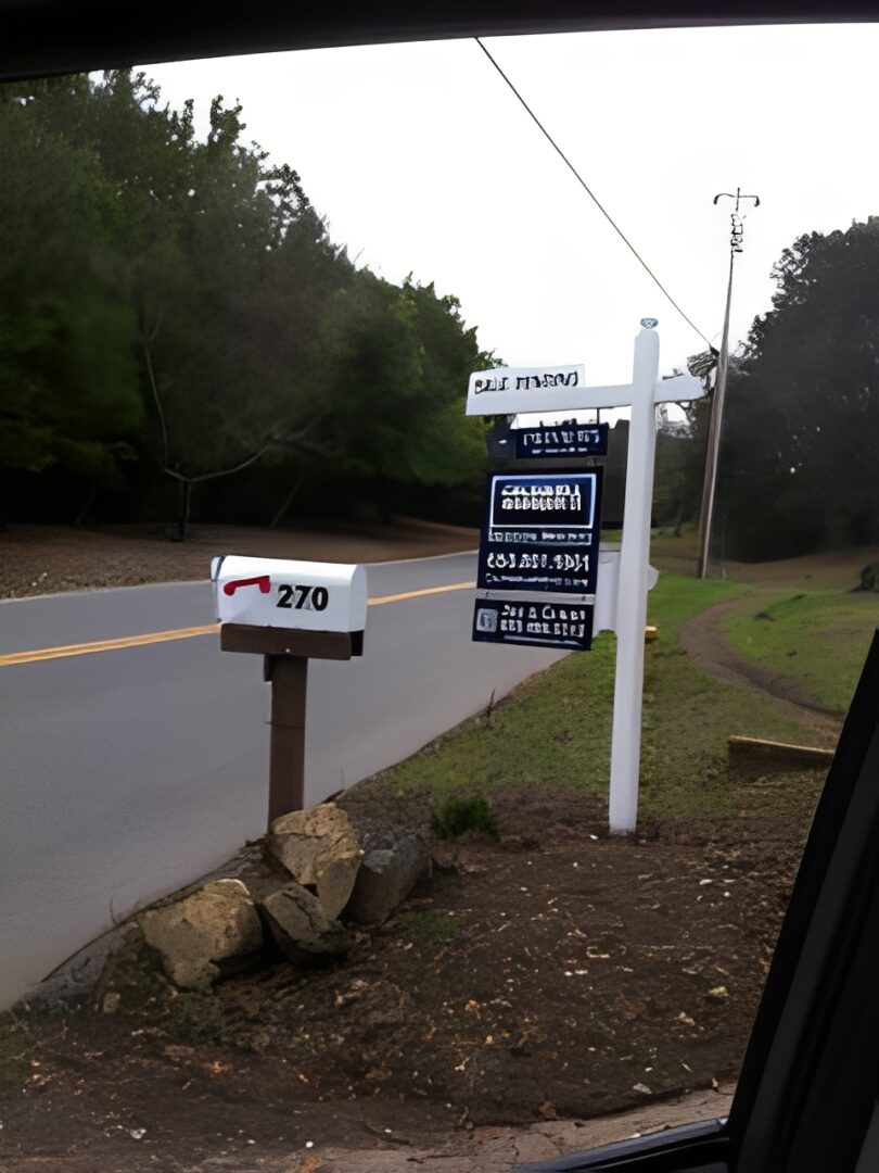 House for sale signpost nearby