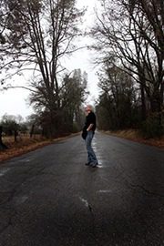 Solitary figure on rural roadway